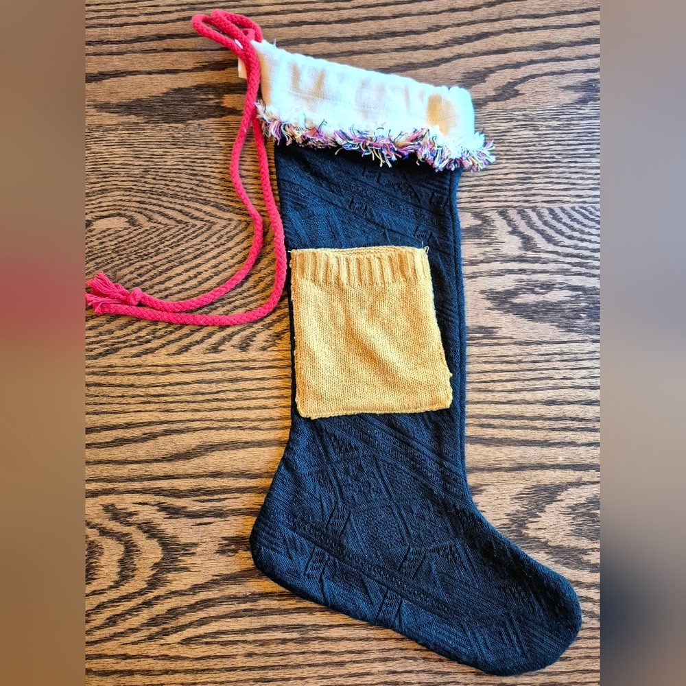 Festive Black Knit Stocking with Pink and Gold Accents